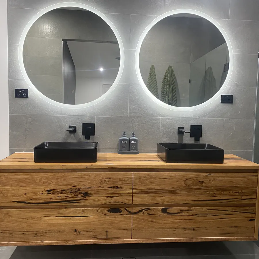Solid timber vanity joinery in a completed renovation