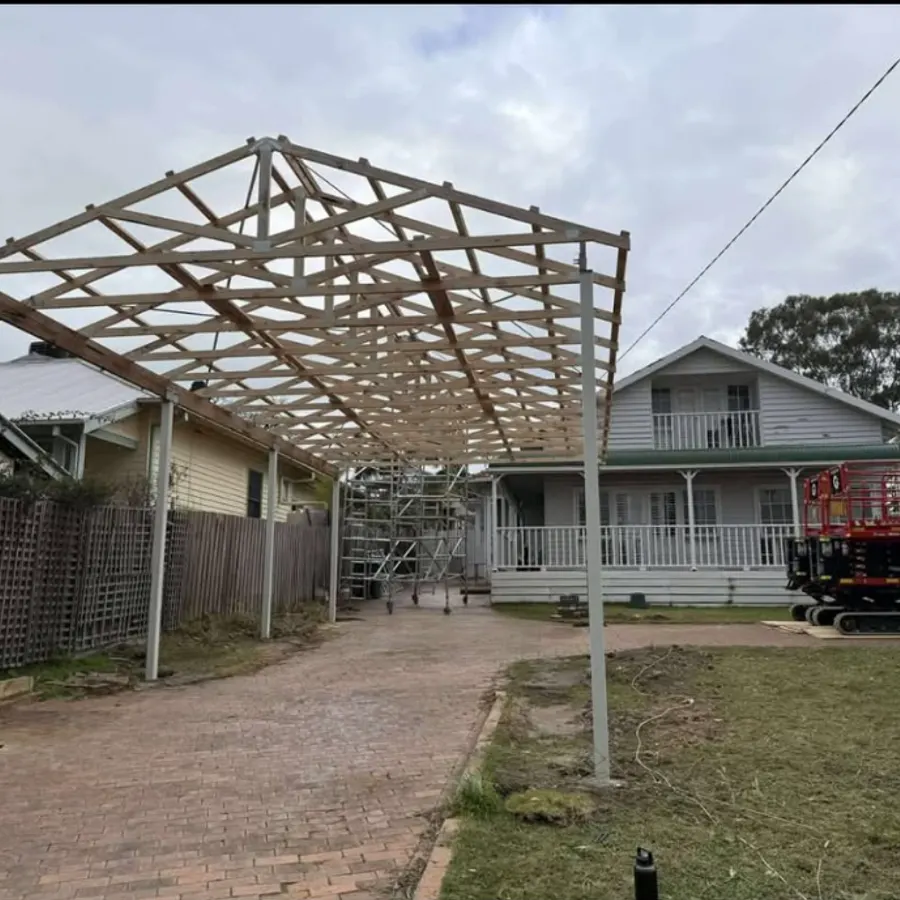 Carport roof frame under construction on steel posts