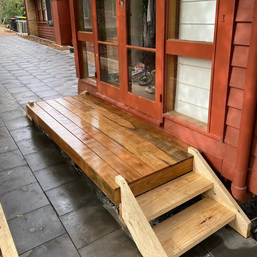 Timber deck landing and steps at a set of french doors
