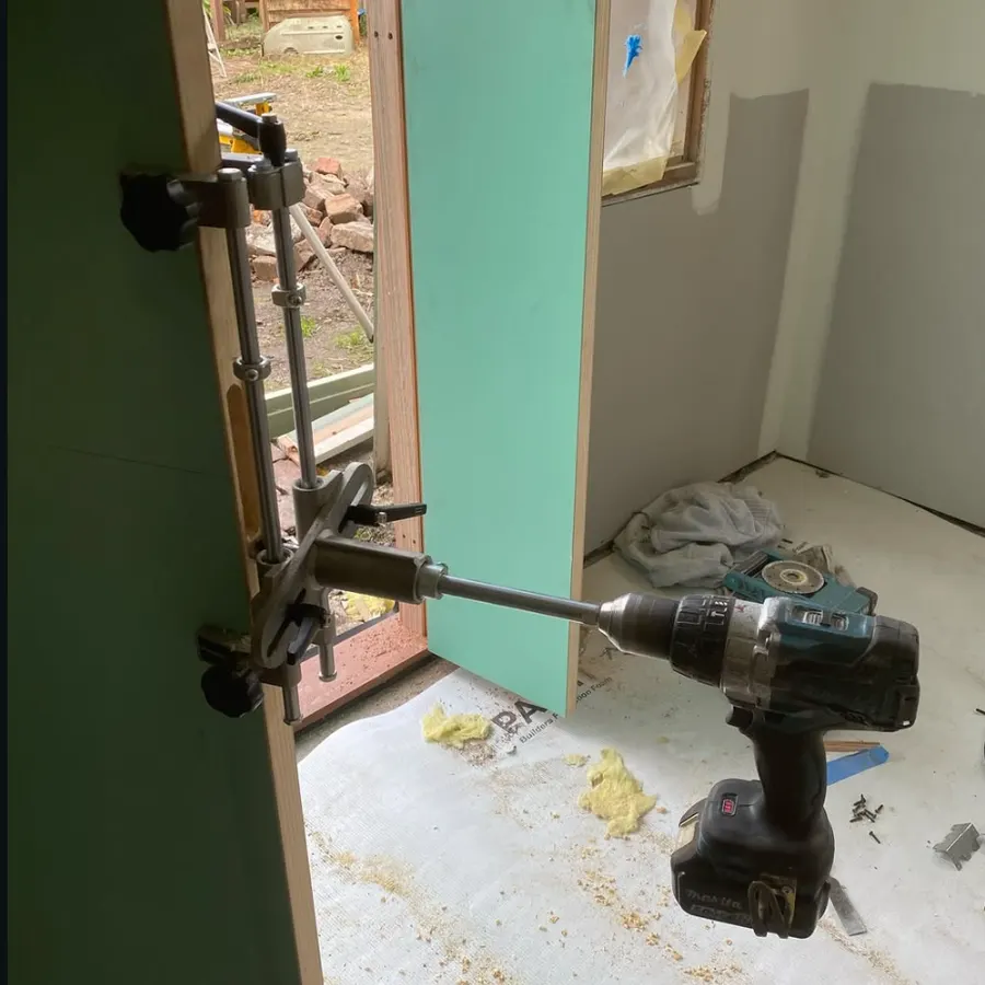 Door hardware being installed into a new internal door