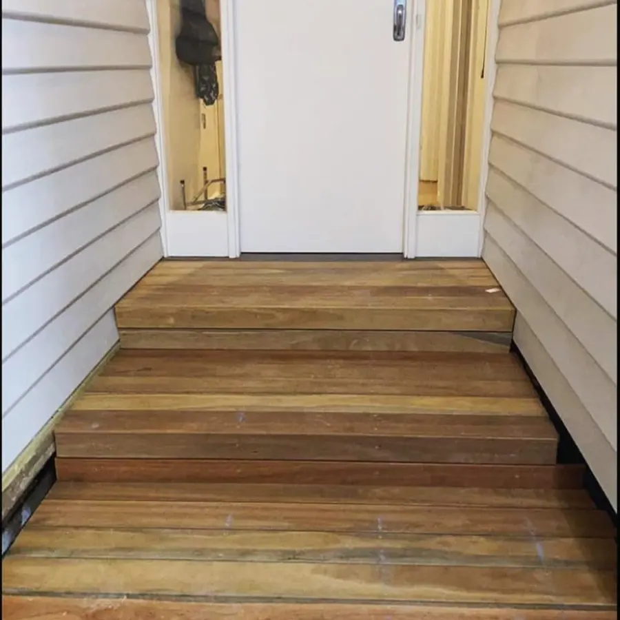 New timber entry steps against weatherboard cladding