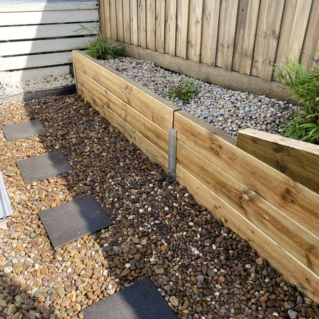 Finished timber retaining wall and garden path