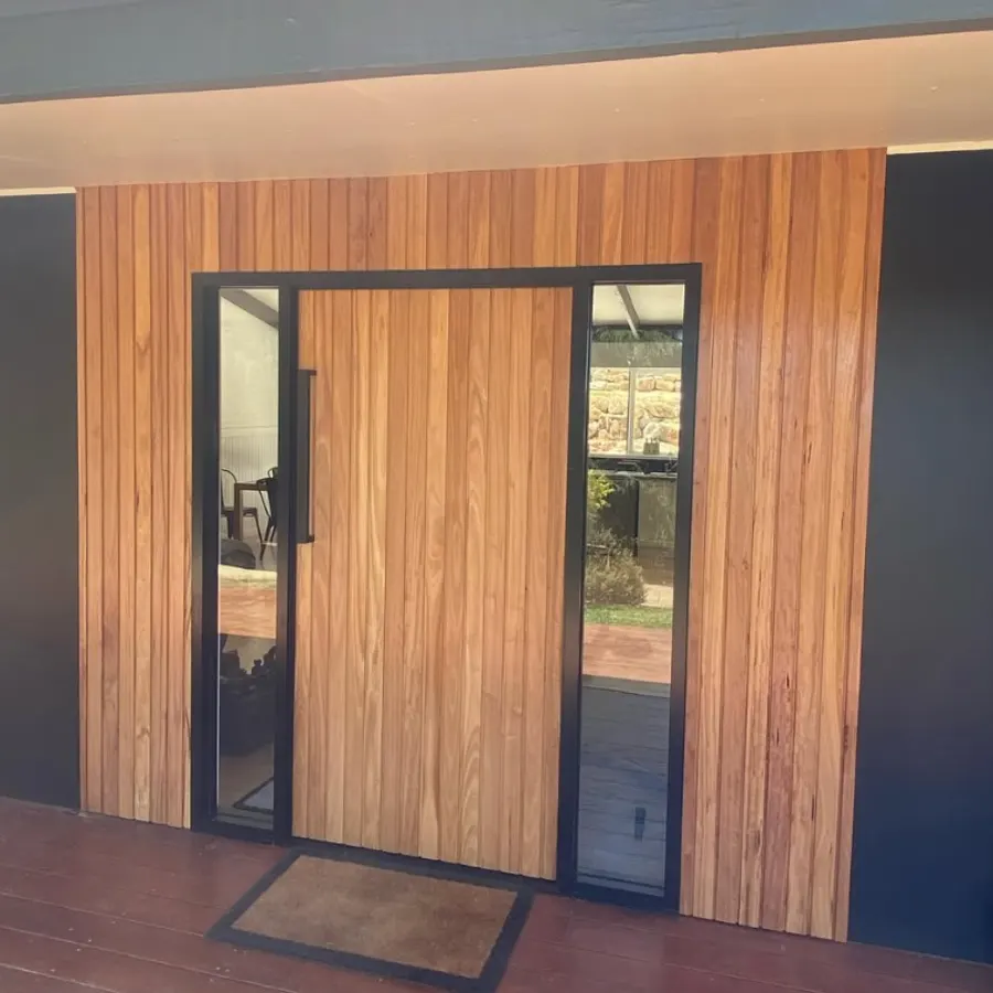 Custom timber entry door with glazed sidelights